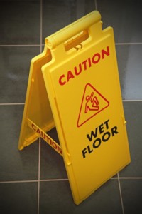 VCT Flooring With Caution Floor Wet Sign