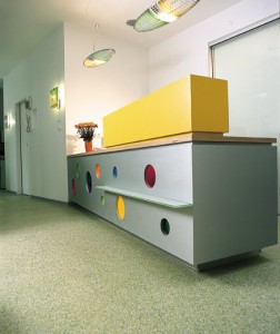 Office desk sits on decorative concrete coating.