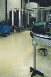 A chemically resistant tan floor coating protects surrounding area from chemical holding tanks.