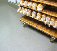 Bread cart moves easily across bakery flooring.